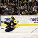 Michigan freshman defenseman Jacob Trouba goes down while handling the puck in the game against Michigan State at Joe Louis Arena on Saturday, Feb. 2. Daniel Brenner I AnnArbor.com